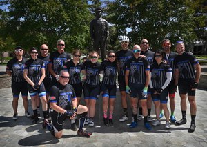 The Code 3 Cycling Team gathers in front of the Westminster Police Department's Officer's Memorial at the end of their 630 mile journey.