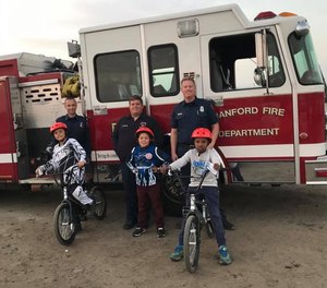 This photo from 2017 shows Hanford firefighters at the local BMX track after donating helmets to kids. The Hanford Fire Department will be holding its first free