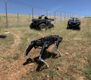 A robot dog operates alongside ATVs in the southwest U.S.