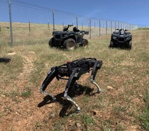 A robot dog operates alongside ATVs in the southwest U.S.
