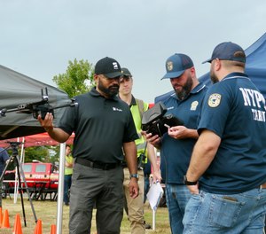 Representatives from Skydio demonstrate the functionality of their X2E 2D/3D aerial mapping technology for NYPD officers.