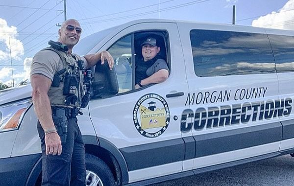 Lt. Eric Fields poses with a Morgan County corrections officer.