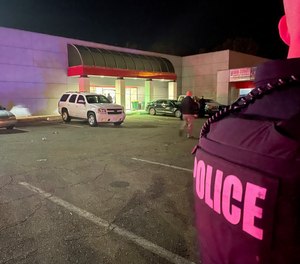 Texarkana police officers investigate a shooting that left one person dead and nine wounded at a Halloween party on Oct. 30, 2021.