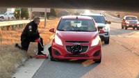 Off-duty officer buys, changes tire for stranded mom and baby