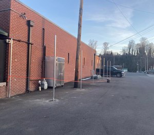 The fence is being built about 6 feet from the jail’s walls and will be finished next week.