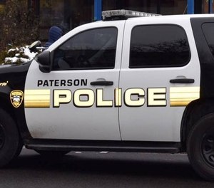 Paterson police say an injured burglary suspect attempted to steal an ambulance while being treated by EMS providers.