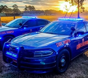 Georgia State Patrol vehicles with a blue light bar.
