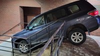 Photos: Woman tries to drive down the stairs at police HQ, blames her GPS