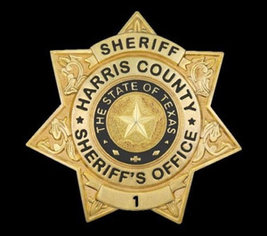 Harris County Sheriff's Office officials say a suspected drunk driver crashed into a fire apparatus twice while attempting to strike a deputy who was directing traffic at a crash scene.
