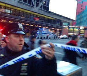 Police respond to a report of an explosion near Times Square on Monday, Dec. 11, 2017, in New York.