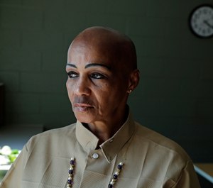 Cheryl Lidel poses for a photo in the Washington Correctional Center in Shelton, Wash. (AP Photo/Ted S. Warren)