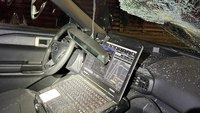 Photos: Man hurls 25-pound railroad tie at patrol car, shatters windshield