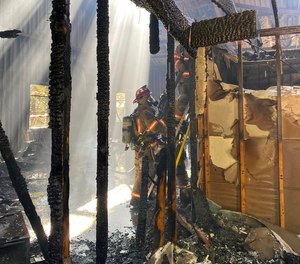 Gainesville Fire spokesman Keith Smith said 10-12 homeless people exited the building and were led to safe areas when the firefighters arrived.