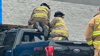 Photos: N.C. firefighters extricate injured driver after truck crashes into Walmart