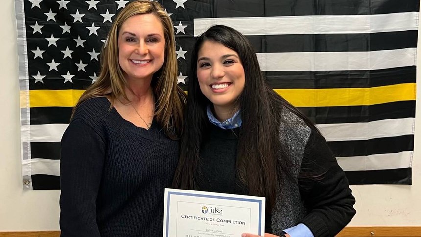 Lorissa Martinez reunites with Officer Megan Elias, who helped her years ago, at the Tulsa Police Department’s Public Safety Communications ceremony.