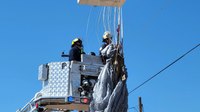 Photos: Ariz. firefighters rescue skydiver after parachute becomes tangled in power lines