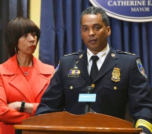 Mayor Catherine Pugh listens as new Baltimore police commissioner Darryl DeSousa makes remarks at City Hall during a news conference, Friday, Jan. 19, 2018 in Baltimore.