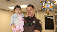 Mich. deputies reunite with toddler they rescued from nearly drowning