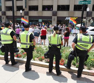 Police officers work security at a Pride parade on June 19, 2018, in Aurora, Illinois.
