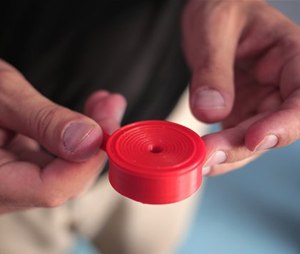 Dr. Tarek Loubani, a Palestinian-Canadian doctor, holds part of a 3D printed stethoscope, in Gaza City.