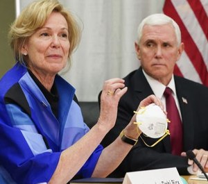 In March, Dr. Deborah Birx, the White House's coronavirus response coordinator, held a 3M N95 mask as she visited 3M headquarters in Maplewood, Minn. (Photo/TNS)