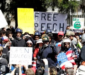 A crowd gathers around speakers during a rally for free speech Thursday, April 27, 2017, in Berkeley, Calif. (AP Photo/Marcio Jose Sanchez)