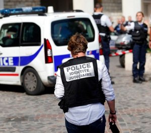 French Police work on the scene where French soldiers were hit and injured by a vehicle in the western Paris suburb of Levallois-Perret near Paris, France, Wednesday, Aug. 9, 2017. (AP Photo/Kamil Zihnioglu)