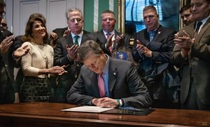 Gov. Charlie Baker signed Senate Bill 2633, which requires departments to have crisis intervention services to prevent PTSD in first responders who are dealing with psychological trauma. (Photo/Gov. Charlie Baker)