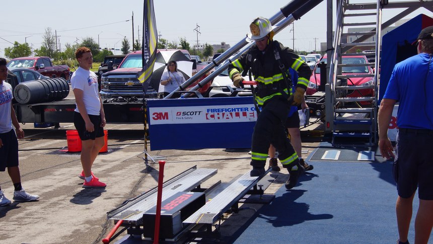 Using the 9-lb. shot mallet provided and with both feet on the diamond plate surface, competitors must drive the 160 lb. steel beam 5 feet. 