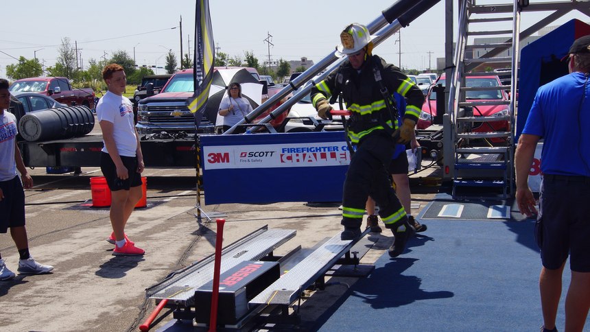 Using the 9-lb. shot mallet provided and with both feet on the diamond plate surface, competitors must drive the 160 lb. steel beam 5 feet.