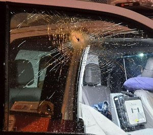 A flying metal bolt smashed the window of an FDNY ambulance on Friday. Police are investigating whether the bolt was intentionally thrown at the rig.