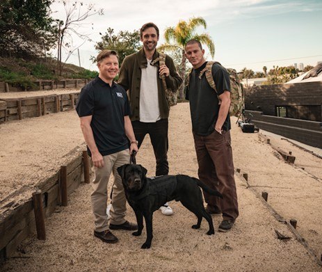 (Left to Right) Navy Captain, Jon, with Labrador, Winston, Dog Co-Director, Reid Carolin, and Dog Co-Director and Actor, Channing Tatum