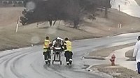 Firefighters ditch ambulance to rescue patient on icy road