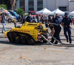 The Los Angeles Fire Department introduced its new firefighting robot at a press conference Tuesday. RS3 can blast 2,500 gallons of water or foam per minute and is designed to battle fires in areas too dangerous for firefighters.
