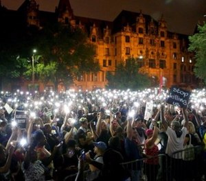 Hundreds of protesters stand outside of the St. Louis city jail on Monday, Sept. 18, 2017. (David Carson/St. Louis Post-Dispatch via AP)