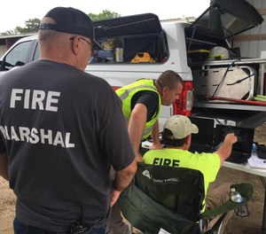 Fire marshals begin review of drone footage as part of their fire investigation of a structure fire.