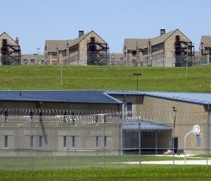 Maximum security housing units at the new Jefferson City Correctional Center sit below dormitory-style housing at a the minimum security Algoa Correctional Center in Jefferson City, Mo.