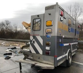 A concrete pumping truck crashed into an ambulance while an EMS crew was pulled over trying to calm a patient, according to officials.