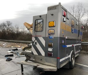 A concrete pumping truck crashed into an ambulance while an EMS crew was pulled over trying to calm a patient, according to officials.