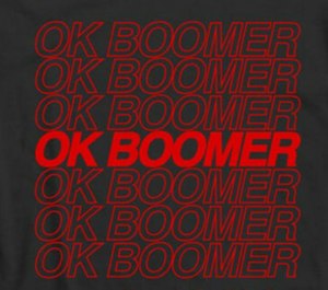An OK boomer T-shirt designed by Grizzly Designs shows a common graphic associated with the meme.