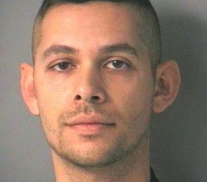 Corey Godinez, 29, allegedly threatened former colleagues after being fired from LifeLine Ambulance in Merrimack, N.H. and showed up to the office with a loaded AR-15 the day after his firing. (Photo/Merrimack Police Department)