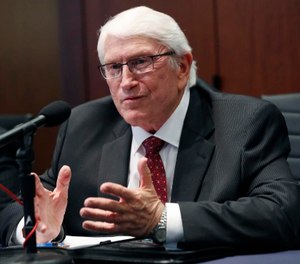 Burl Cain responds to a reporter's question after being introduced by Gov. Tate Reeves as the new commissioner of the Mississippi Department of Corrections during his daily coronavirus update for media in Jackson, Miss. (AP Photo/Rogelio V. Solis)