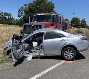 A CAL FIRE apparatus collided with a sedan Tuesday morning while responding to a fire call. A civilian motorist sustained major injuries in the crash, officials said. (Photo/California Highway Patrol)