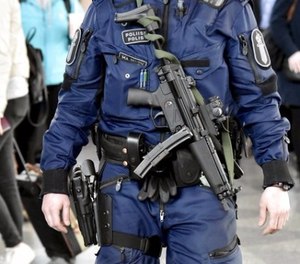 This is a April 13, 2017 file photo of a Finnish police officer carrying a MP5 submachine gun patrols at the Helsinki-Vantaa airport in Vantaa Finland . Finnish police officers will soon have MP5 submachine guns in addition to their normal equipment. (Jussi Nukari/Lehtikuva, File via AP)