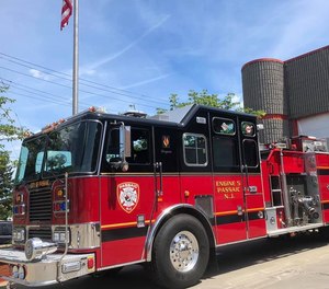 A Passaic fire apparatus collided with a minivan at an intersection on Sunday. Three firefighters were injured in the crash.