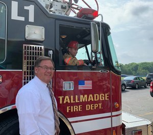 Make-A-Wish volunteers joined Tallmadge Mayor David Kline and city firefighters at the assembly to make the surprise announcement that both his wishes were coming true, much to the delight of Ian and his family.