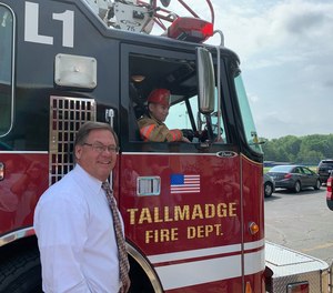 Make-A-Wish volunteers joined Tallmadge Mayor David Kline and city firefighters at the assembly to make the surprise announcement that both his wishes were coming true, much to the delight of Ian and his family.