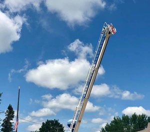 The Waterville Fire Department honored Potter by raising a flag from a ladder on one of the engines.