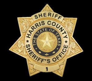 Harris County Sheriff's Office officials say a suspected drunk driver crashed into a fire apparatus twice while attempting to strike a deputy who was directing traffic at a crash scene.