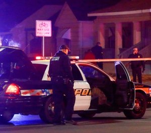 Wichita police investigate a call of a possible hostage situation near the corner of McCormick and Seneca in Wichita, Ks Thursday night 12/28. (Fernando Salazar /The Wichita Eagle via AP)